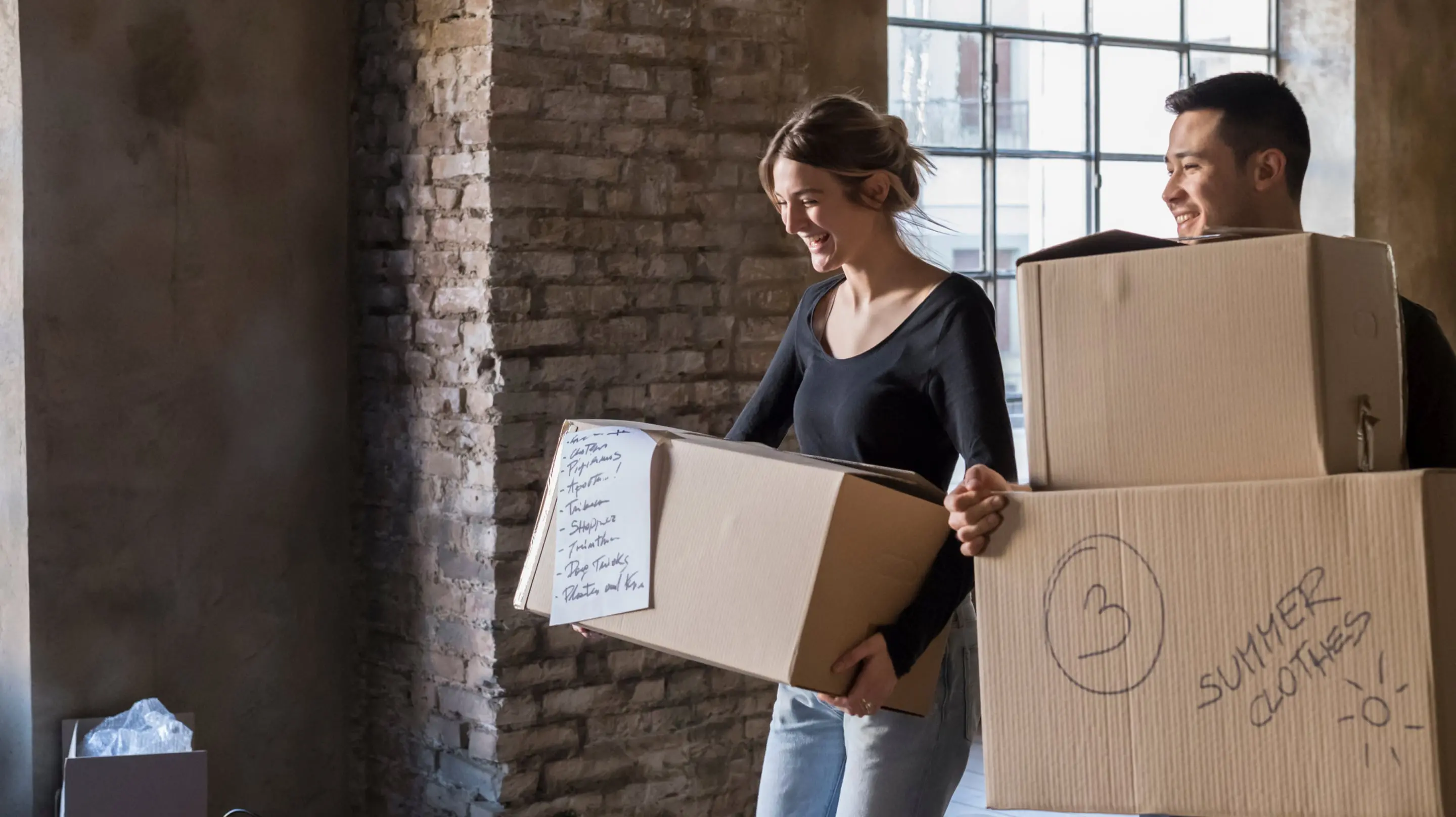 Happy couple moving out